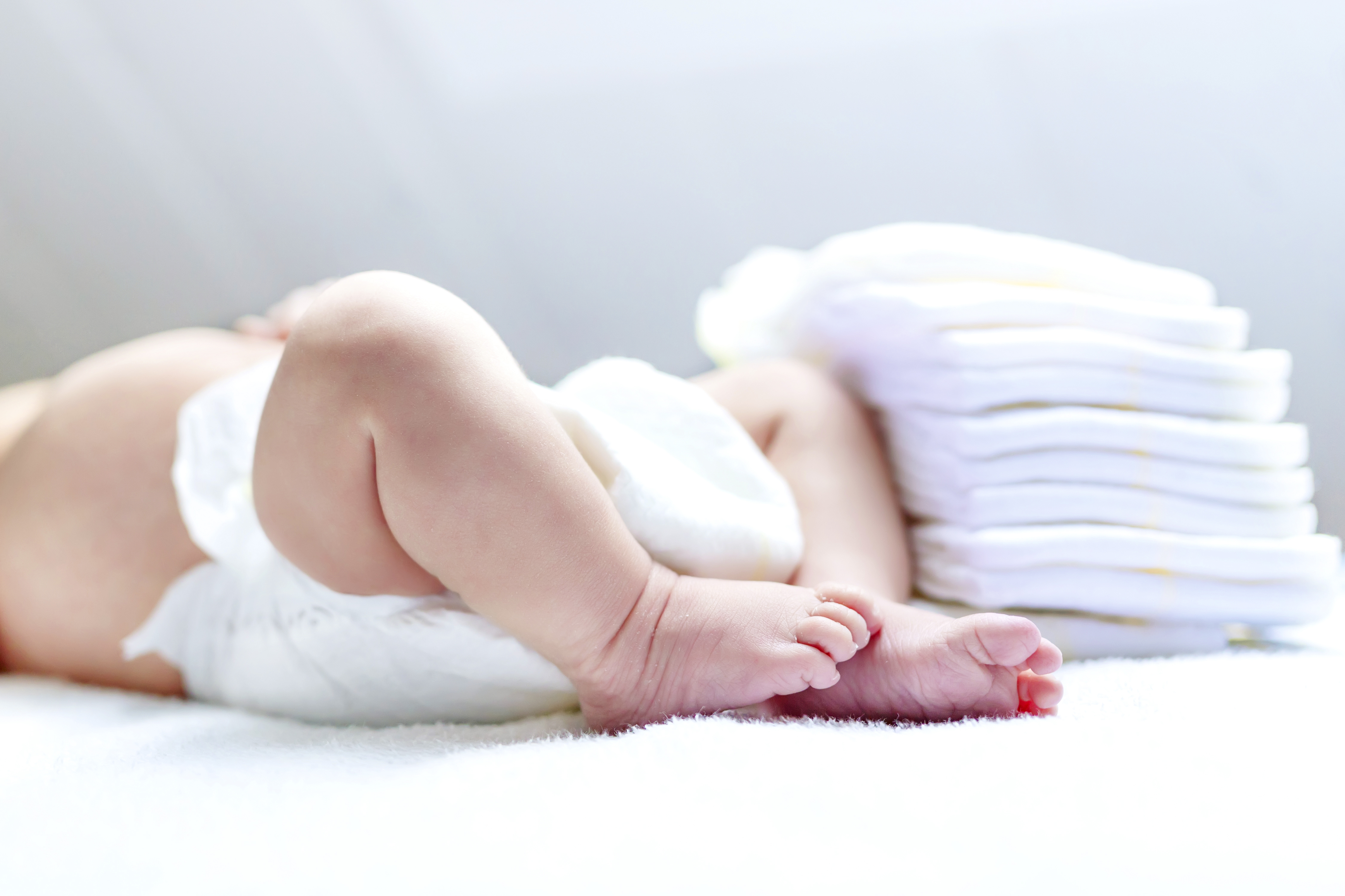 Baby with diapers on changing table